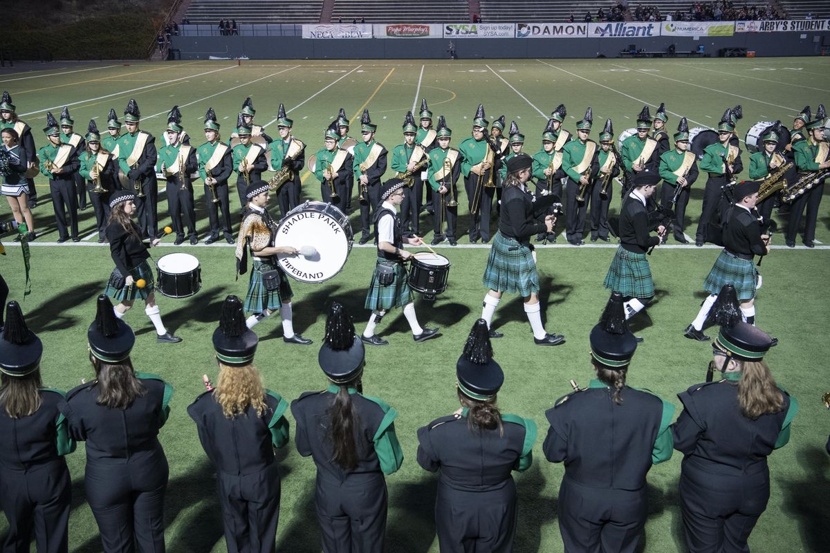 Members of the Shadle Park High School marching band welcome their bagpipe unit after playing at halftime of the football game, Thursday, Oct. 26, 2017, at Joe Albi Stadium. Shadle has one of the last marching bands at a Spokane High School. (Jesse Tinsley / The Spokesman-Review)