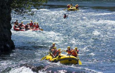 
Peak 7 Adventures takes three rafts full of kids down the Spokane River and through the Bowl and Pitcher. The excursions are designed to show youngsters that hope exists through God.
 (Photos by Christopher Anderson / The Spokesman-Review)