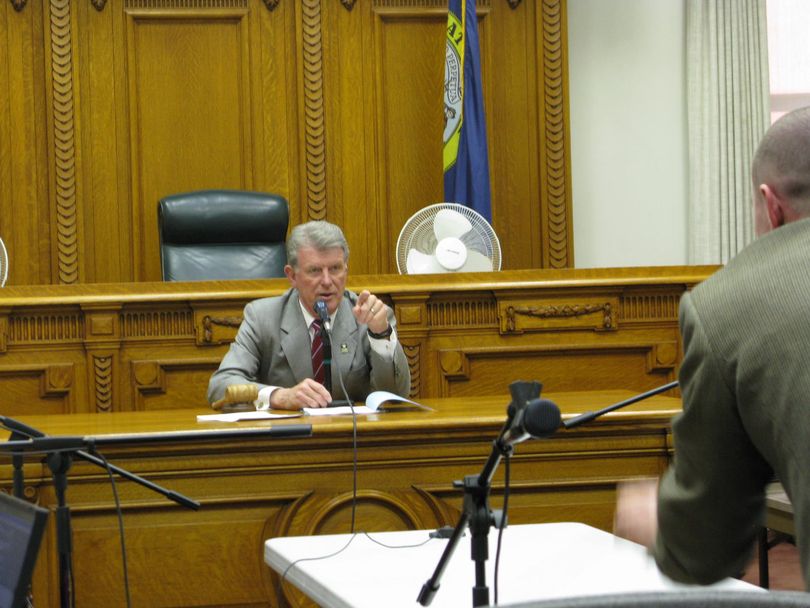 Gov. Butch Otter speaks to state Lands Department employee Patrick Hodges at the start of a special Land Board meeting on Wednesday (Betsy Russell)