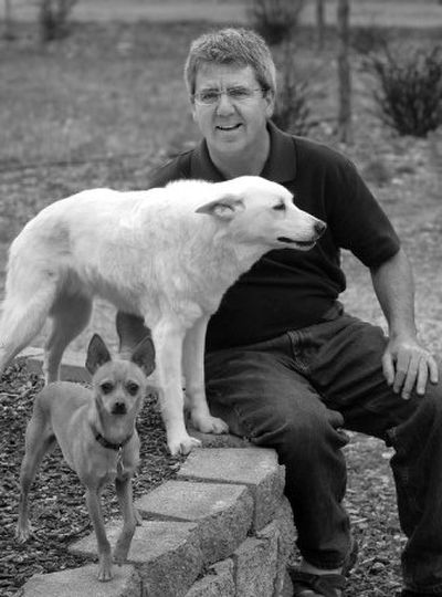 
Glenn Schultheis, owner of Dooty Free Dog Waste Removal Service, sits with his dogs  Cid, front, and Oggie at their Green Bluff home. 
 (Dan Pelle / The Spokesman-Review)