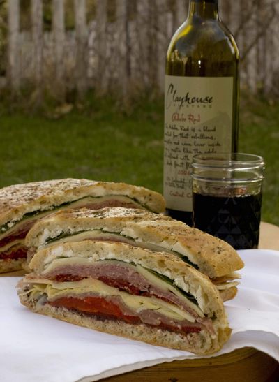 A collection of flavors and juices blend together in this Overnight Brick Sandwich, perfect for a picnic.  (Associated Press / The Spokesman-Review)
