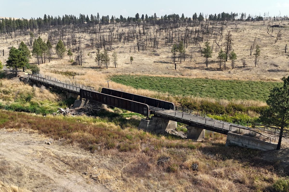 The former rail bridge on the Palouse to Cascades State Park Trail, formerly called the John Wayne Trail, over Pine Creek near Malden and Pine City, Washington, was damaged in the Labor Day fire that burned most of the towns in 2020 and has been closed, shown Thursday, Sept. 11, 2025.  (Jesse Tinsley/The Spokesman-Review)