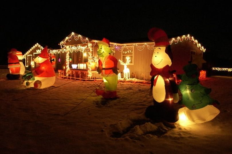 Arlene and Gene Vanhorn's holiday theme home is filled with colorful inflatable Christmas decorations at 5240 McKinzie Rd. in Otis Orchards in December 2009. (J. Bart Rayniak)