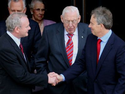 
British Prime Minister Tony Blair, right, shakes hands Tuesday with Northern Ireland's Deputy First Minister Martin McGuinness as  First Minister Ian Paisley looks on   in Belfast, Northern Ireland. 
 (Associated Press / The Spokesman-Review)