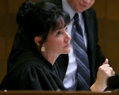 55th District Judge Rosemarie Aquilina confers with attorneys during a preliminary hearing for Tim and Lisa Holland, Wednesday, March 1, 2006, in Mason, Mich. Aquilina, today a judge of the 30th circuit court in Ingham County, Mich., will be the keynote speaker for the YWCA Spokane 2019 Women of Achievement awards on Oct. 11, 2019. She is perhaps best known for presiding over the U.S. gymnastics sex abuse trial of Larry Nassar. (AL GOLDIS / Associated Press)
