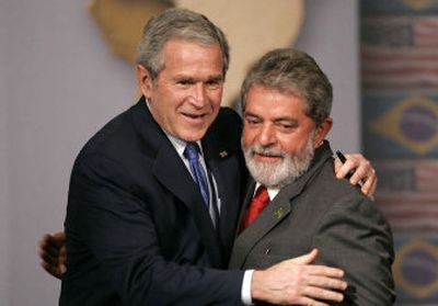 
President embraces Brazil's President Luiz Inacio Lula da Silva after a news conference in Sao Paulo on Friday. Bush is on a  weeklong tour of Latin America. 
 (Photos by Associated Press / The Spokesman-Review)