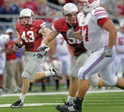 WSU middle linebacker Alex Hoffman-Ellis, left, returned to practice Tuesday.  (Christopher Anderson / The Spokesman-Review)