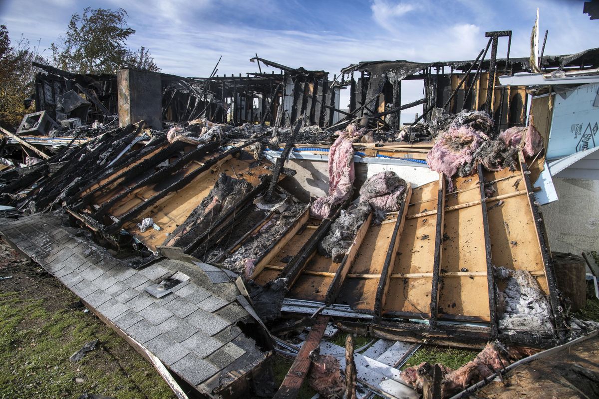 The Fiorini home at 6001 N. Starr Road in Otis Orchards is seen on Oct. 29, 2016, the morning after it was destroyed by fire. (Dan Pelle / The Spokesman-Review)