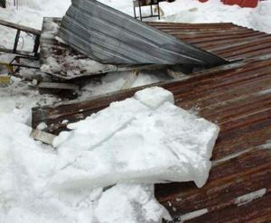 This metal roof of a lean-to porch collapsed on two men at a residence in the Rathdrum area on Wednesday. (Photo courtesy of Northern Lakes Fire District via Coeur d'Alene Press)