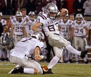 Montana's Brody McKnight (83) misses the ball after holder Jeff Larson (7) lost control of it on a field goal attempt during the first quarter of the NCAA Division I FCS college football championship game against Villanova Friday, Dec. 18, 2009 in Chattanooga, Tenn. Villanova won 23-21. (Wade Payne / Fr23601 Ap)