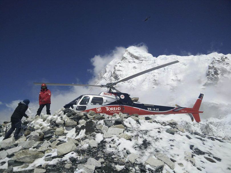 In this photo provided by Azim Afif, a helicopter prepares to rescue people from camp 1 and 2 at Everest Base Camp, Nepal on Monday, April, 27, 2015. On Saturday, a large avalanche triggered by Nepal's massive earthquake slammed into a section of the Mount Everest mountaineering base camp, killing a number of people and left others unaccounted for. Afif and his team of four others from the Universiti Teknologi Malaysia (UTM) all survived the avalanche. (Azim Afif via AP) (Azim Afif / Azim Afif)