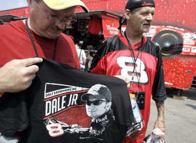 
Dale Earnhardt Jr. race fan Lynn Everson, left, shows off a Earnhardt T-shirt next to friend Rick Kilbride.Associated Press
 (Associated Press / The Spokesman-Review)