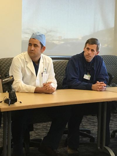 Dr. Marcus Torgenson (left) and anesthesiologist David Wineinger talk about amputating the leg of a man trapped in a semi crash. (Nina Culver)