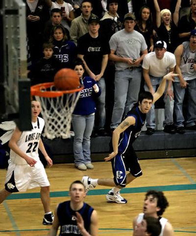 
Coeur d'Alene's Nate Bligh holds his follow-through as he watches his 3-pointer fall Thursday. 
 (Bruce Twitchell Special to / The Spokesman-Review)