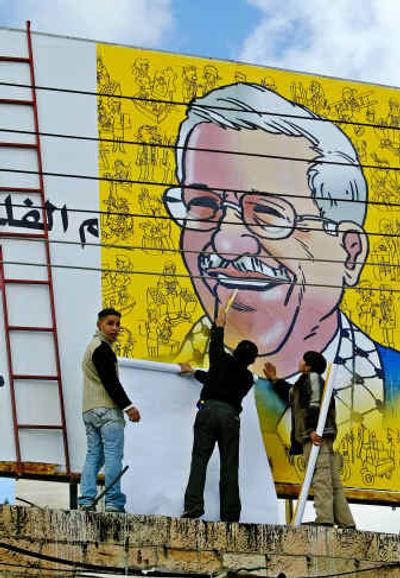 
Palestinian youths erect a billboard showing President-elect Mahmoud Abbas, also known as Abu Mazen, on top of a building Tuesday in Ramallah.Palestinian youths erect a billboard showing President-elect Mahmoud Abbas, also known as Abu Mazen, on top of a building Tuesday in Ramallah.
 (Associated PressAssociated Press / The Spokesman-Review)