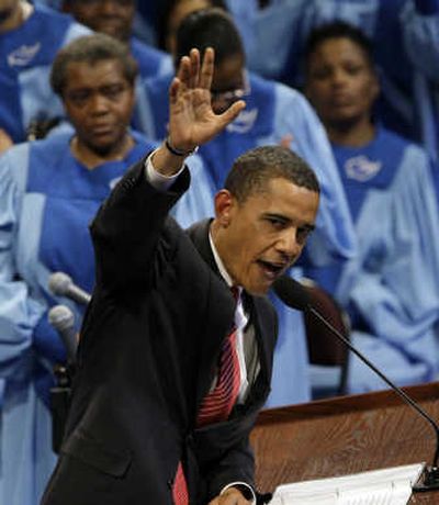 
Sen. Barack Obama  waves  after speaking Sunday at Chicago's Apostolic Church of God. Associated Press
 (Associated Press / The Spokesman-Review)