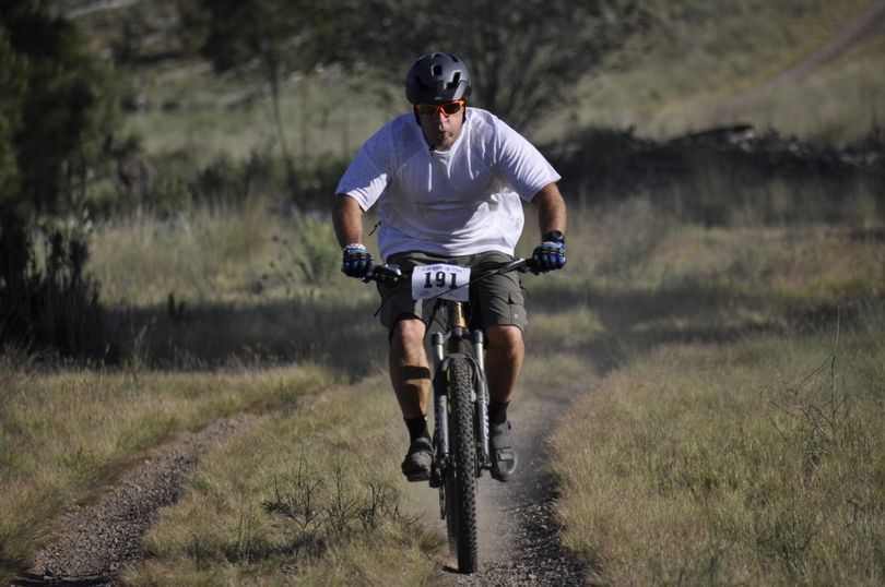 A rider smokes across a flat during the 24 Hours Round the Clock mountain bike race at Riverside State Park. (Rich Landers)