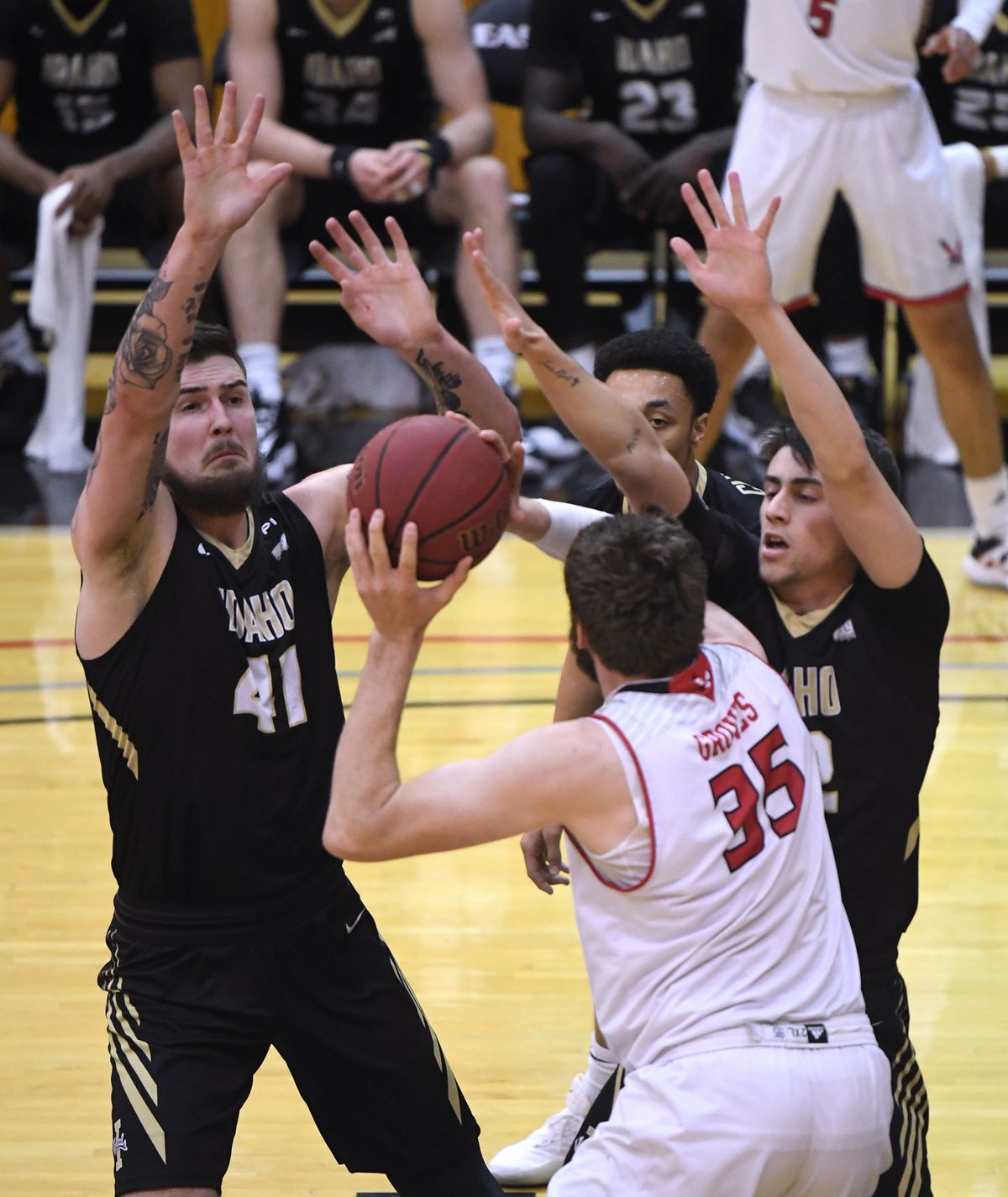 Eastern Washington forward Tanner Groves is triple-teamed in the key by, from left, Idaho center Jack Wilson, guard Ja’Vary Christmas and forward Chance Garvin during the first half of a Big Sky game on Feb. 13 in Cheney. All three Vandals are returning.  (Colin Mulvany/THE SPOKESMAN-REVIEW)
