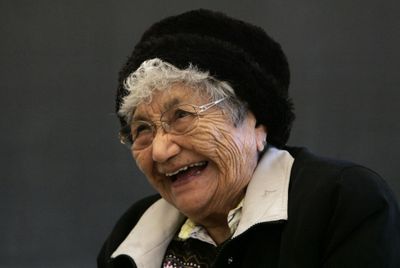 A native speaker of Yakama Sahaptin, elder Virginia Beavert, 87, shares a laugh with her students during a class. (Associated Press / The Spokesman-Review)