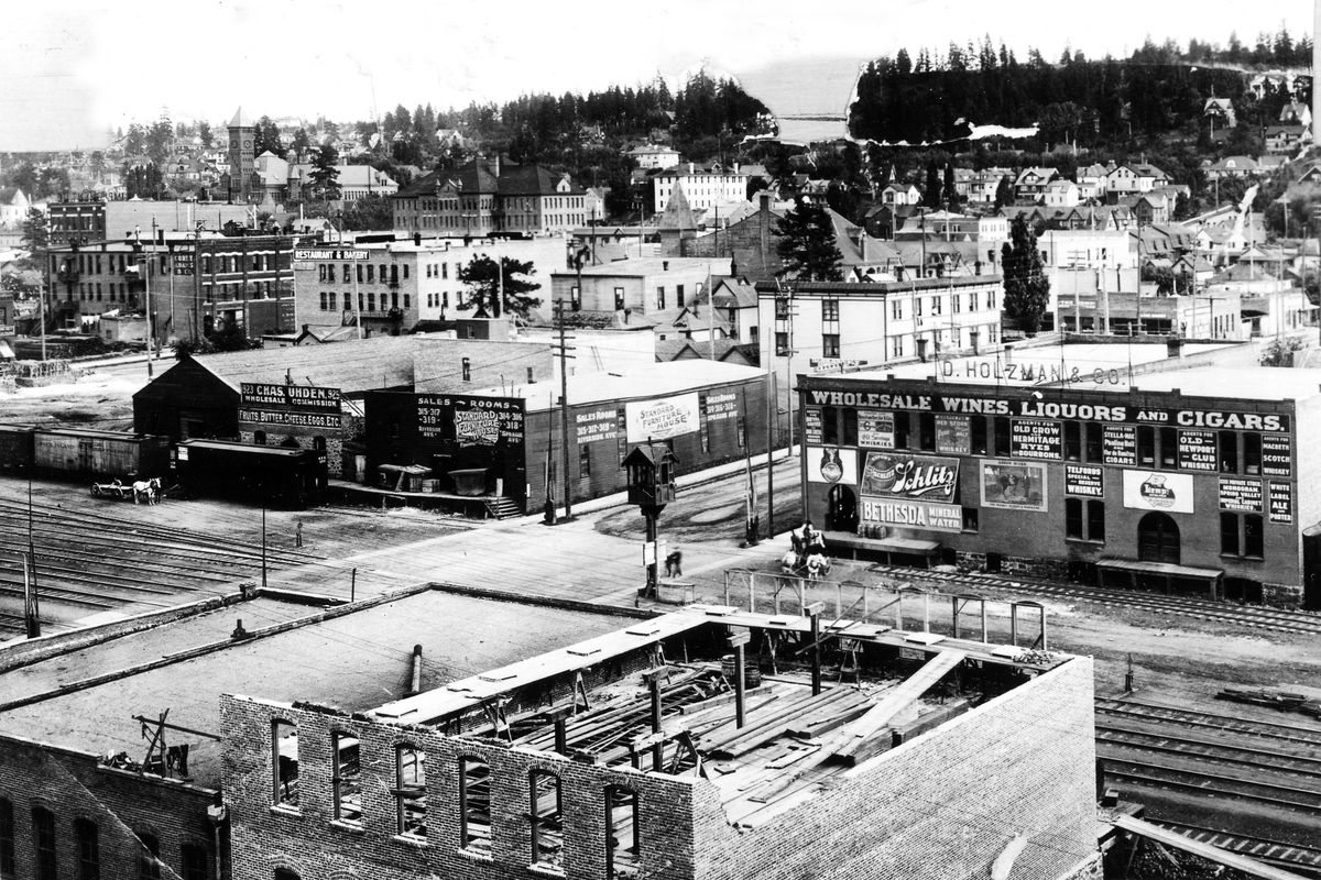 Circa 1900: This view looking southwest over Railroad Avenue shows the warehouse of D. Holzman & Co. at right. The building was used by the liquor distributor until 1916.