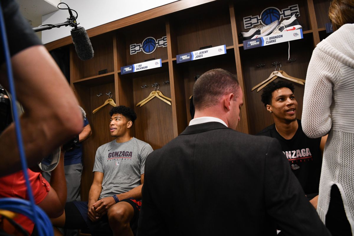 Gonzaga Bulldogs forward Rui Hachimura (21) smiles while talking to reporters with Gonzaga Bulldogs forward Brandon Clarke (15) before an NCAA Mens basketball practice on Wednesday, March 20, 2019, at in Salt Lake City, Utah. (Tyler Tjomsland / The Spokesman-Review)