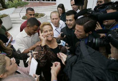 
Estela Lebron, mother of Jose Padilla, smiles as she speaks  outside federal court after her son was sentenced. Associated Press
 (Associated Press / The Spokesman-Review)
