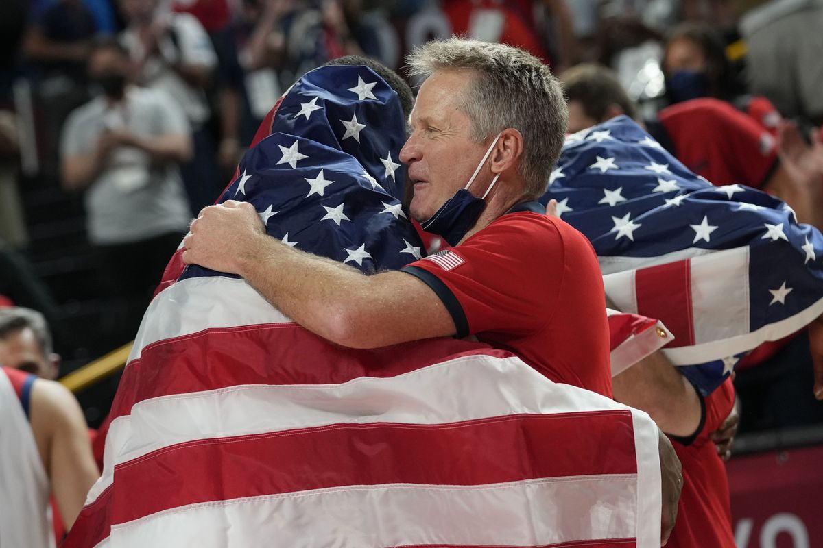 United States assistant coach Steve Kerr, right, celebrates with players after their win over France in a men's basketball Gold medal game at the 2020 Summer Olympics, Saturday, Aug. 7, 2021, in Saitama, Japan.   (Associated Press)