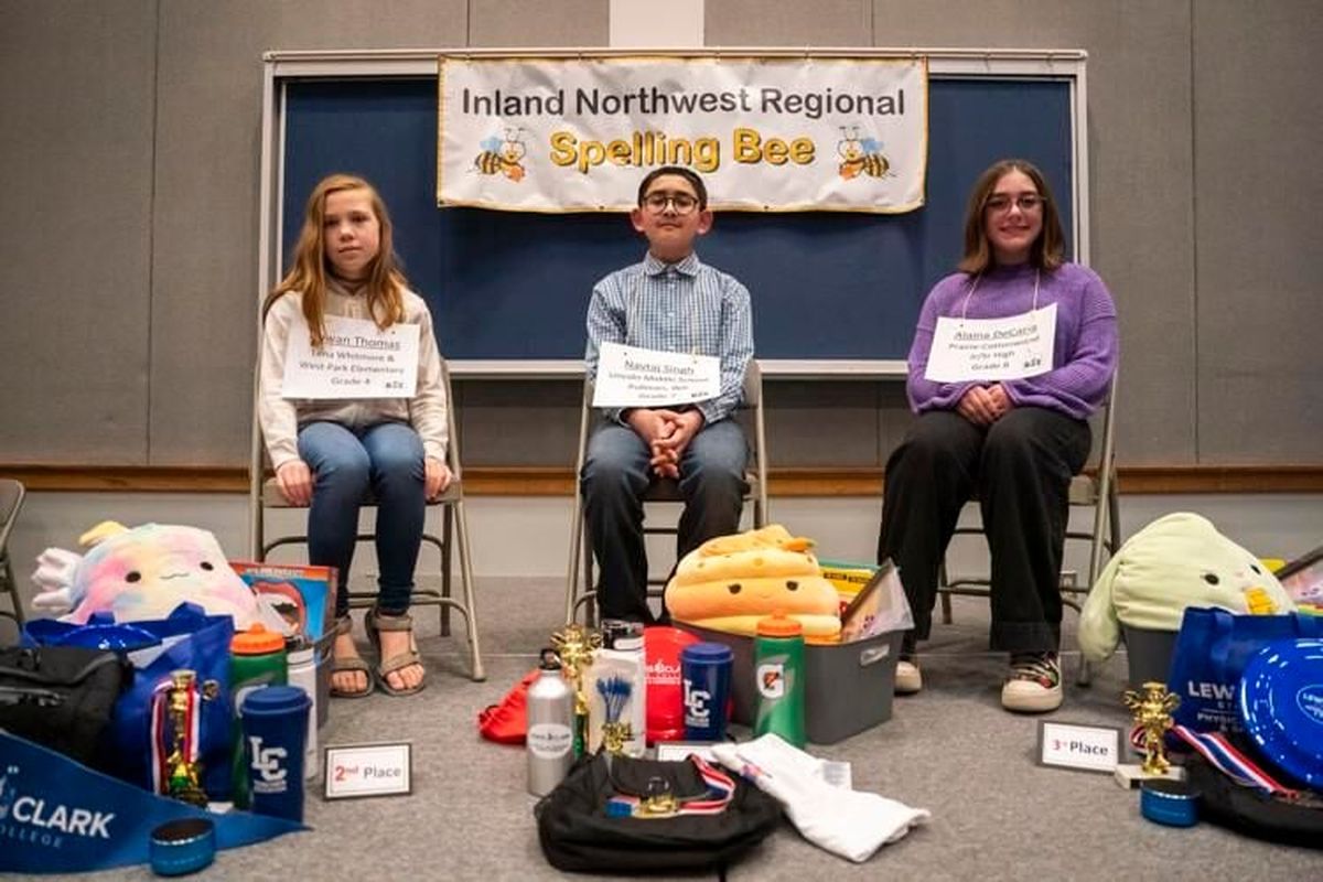 Rowan Thomas, of Lena Whitmore and West Park Elementary, left, Nataj Singh, of Lincoln Middle School, and Alaina DeCaria, of Prairie-Cottonwood Jr./Sr. High School, pose for a photo after placing in the top three of the 38th annual Inland Northwest Regional Spelling Bee on Saturday inside the Williams Conference Center in Lewiston, Idaho.  (Jordon Opp/Lewiston Tribune)