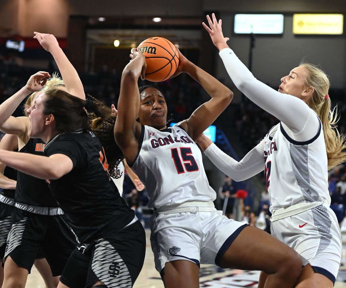 Gonzaga forward Yvonne Ejim (15) falls back as she grabs a rebound during the first half of an NCAA college basketball game, Thursday, Nov. 18, 2021, in the McCarthey Athletic Center.  (COLIN MULVANY/THE SPOKESMAN-REVIEW)