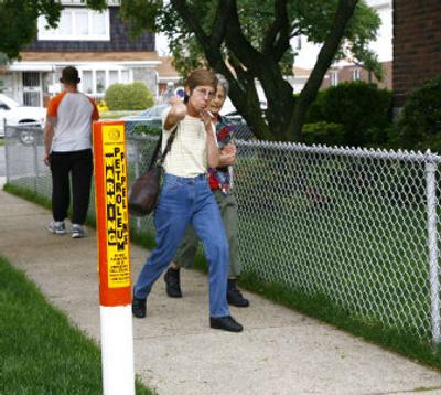 
A marker indicates the route of the jet fuel pipeline supplying JFK airport in the neighborhood of Howard Beach, Queens. 
 (Associated Press / The Spokesman-Review)