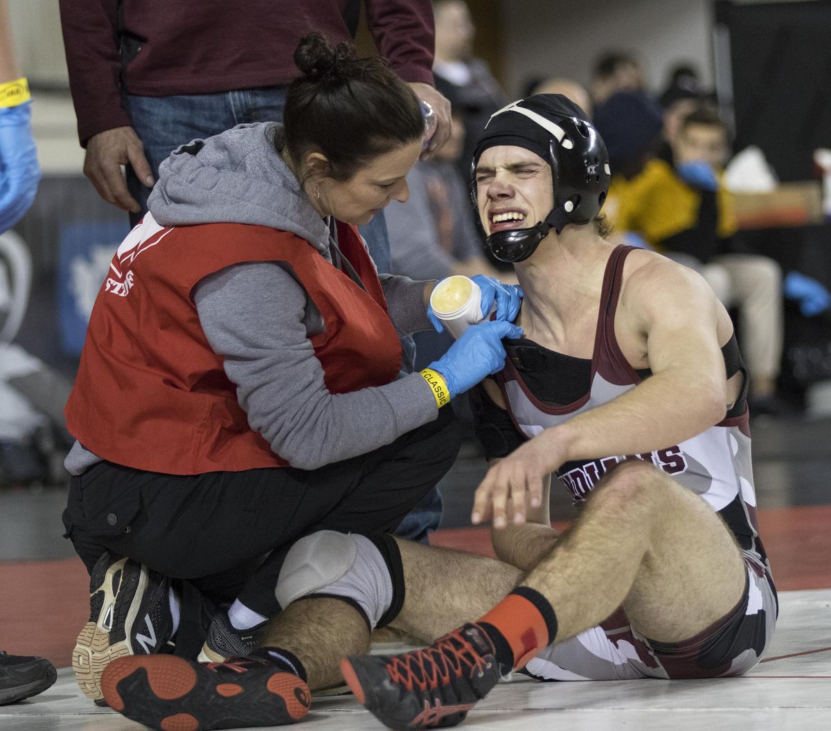 Colville’s Reuben Seeman, right, was winning his match with Sultan’s Aidan Fleming until he reinjured his shoulder late in the third period during their 132-pound match at State 1A wrestling in Tacoma on Friday, Feb. 21, 2020. (Patrick Hagerty / For The Spokesman-Review)