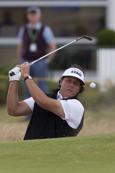 Defending British Open champion Phil Mickelson plays out of a bunker during practice at Royal Liverpool. (Associated Press)