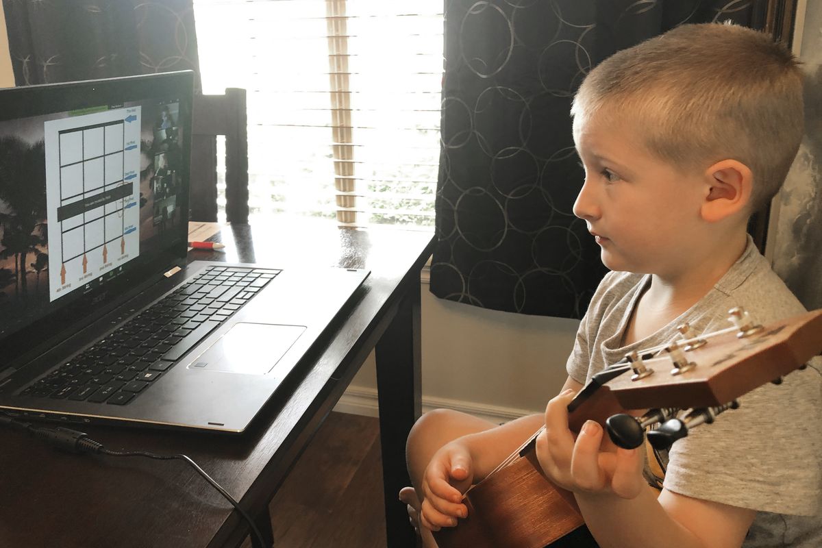 James does school work at his Tahlequah, Oklahoma, home.  (Christina Rothermel Branham)