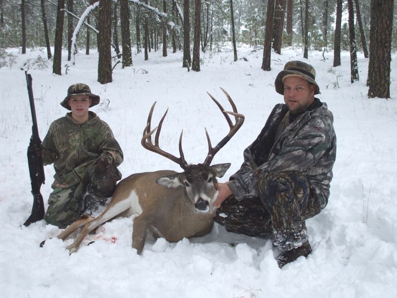 Gabe Bancroft, 14, with a whitetail buck he bagged with a .50-caliber muzzleloader at 22 yards with the help of his dad,  Chris Bancroft. (Shawn O'Kert)