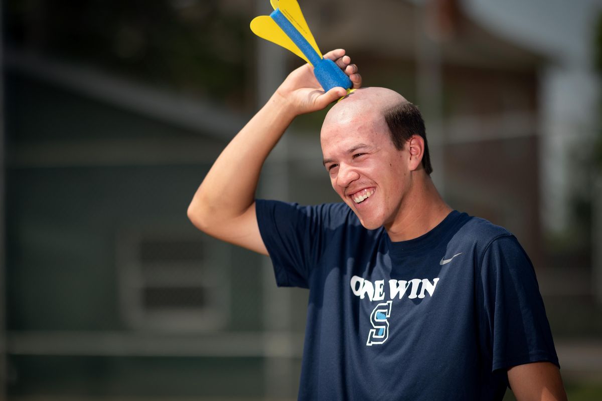 Community Colleges of Spokane baseball player Brenden Duncan, a North Central grad, is the star of a viral video with millions of views in which teammates launch foam lawn darts that stick to his bald head. (Colin Mulvany / The Spokesman-Review)