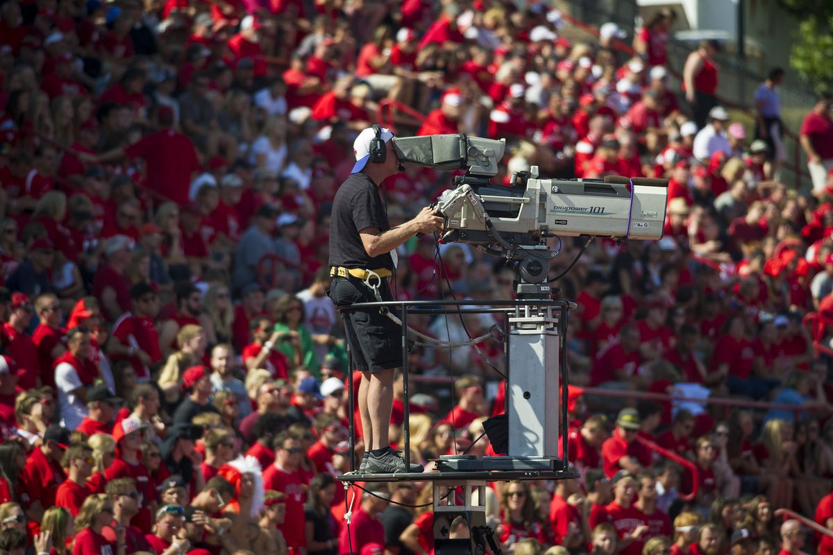 An ESPN cameraman shoots the Eastern Washington vs. Sam Houston State game for a national TV crowd during in the second half at Roos Field in Cheney, Wash., on Saturday, Aug. 23, 2014.  (COLIN MULVANY/The Spokesman-Review)