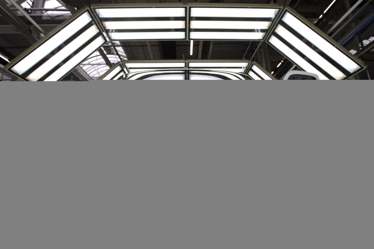 A van sits in a light tunnel at the Mercedes-Benz automobile plant in Ludwigsfelde, near Berlin on June 23, 2015. (Associated Press)