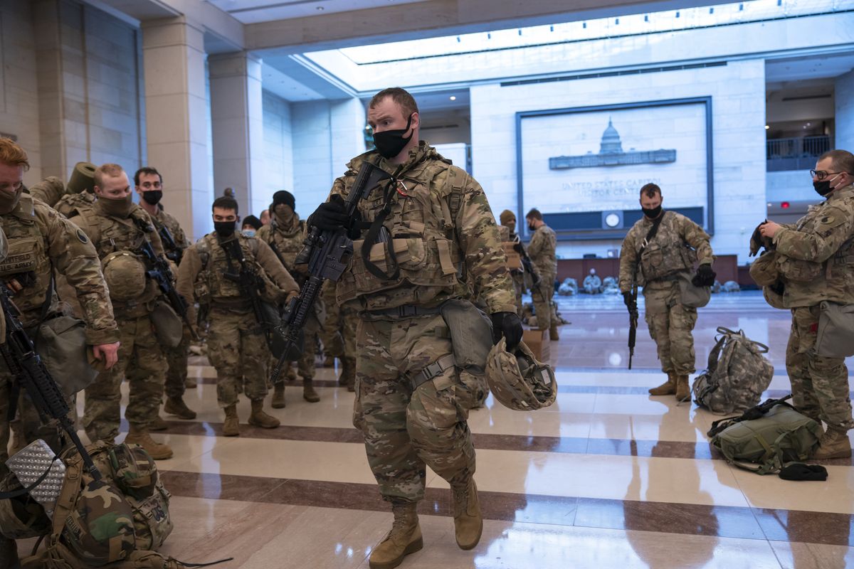 Hundreds of National Guard troops hold inside the Capitol Visitor