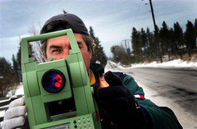 
Dragomri Bojat, a Serbian immigrant, surveys Flint Road in Airway Heights on Tuesday for Storhaug Engineering. With better English skills, he's hopeful he'll be able to take on a more challenging position as an electrical engineer at Storhaug. 
 (Jed Conklin / The Spokesman-Review)