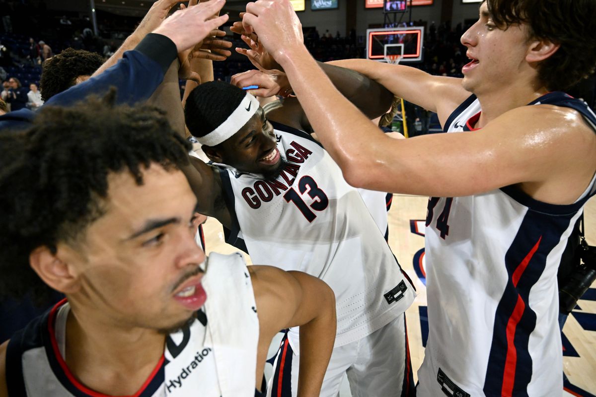 Gonzaga forward Graham Ike (13) gets his head rubbed by teammates after being name player of the game after the Zags defeated the Tigers 100-76 during a NCAA college basketball game, Wednesday, Dec. 20, 2023, in the McCarthey Athletic Center.  (COLIN MULVANY)