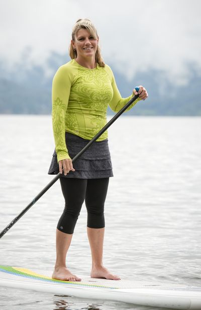 Kym Murdock, owner of CDA Paddleboard, paddles in Lake Coeur d’Alene. (Jed Conklin)