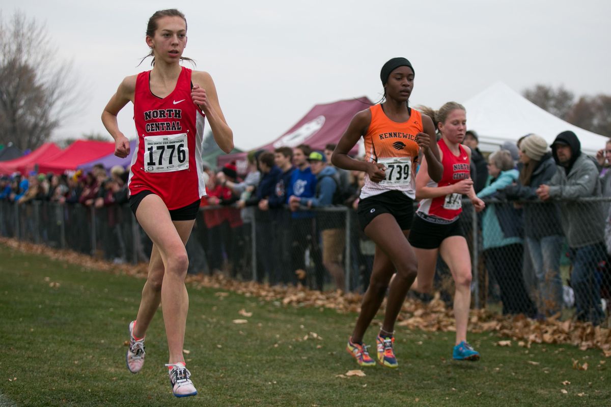 North Central’s Allie Janke, left, competes in the State 3A girls state cross country championship Saturday, Nov. 9, 2019, at Sun Willows Golf Course in Pasco. (Amanda Ray / Yakima Herald-Republic)
