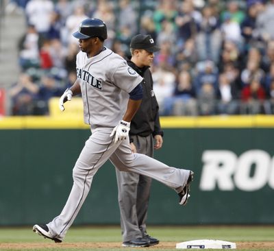 Seattle’s Carlos Peguero rounds second after his fifth-inning homer. (Associated Press)