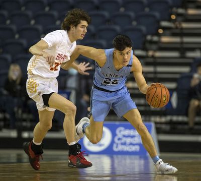 Central Valley’s Dylan Darling, right, dribbles around the defense of Kamiakin’s Trey Arland during action in a State 4A State first-round loser-out game in Tacoma, Wash. on Wednesday, March 2, 2022. Darling led all scorers with 30 points but Kamiakin won 77-71 to advance.  (Patrick Hagerty/For The Spokesman-Review)