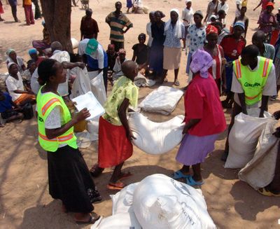 United Nations World Food Program workers distribute food in  Zimbabwe on Thursday.  (Associated Press / The Spokesman-Review)