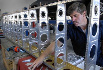 
Steve Allbee works on the ribs of the right wing of his Van's RV-7 airplane in his transmission shop in Spokane Valley on Friday.
 (Dan Pelle / The Spokesman-Review)