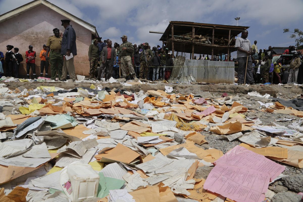 People look on after the Precious Talent Top School building collapsed in Kenya