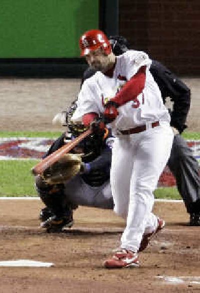 
St. Louis starting pitcher Jeff Suppan hits a solo homer during the second inning Saturday against New York. 
 (Associated Press / The Spokesman-Review)