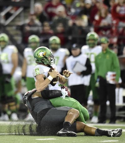 Washington State Cougars nose tackle Robert Barber (92) sacks Oregon Ducks quarterback Dakota Prukop (9) during the first half of a college football game on Saturday, Oct 1, 2016, at Martin Stadium in Pullman, Wash. (Tyler Tjomsland / The Spokesman-Review)