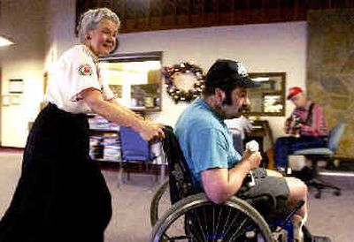
Volunteer Elisabeth O'Meara, left, pushes the wheelchair of John LeMon while they dance together at Evergreen Assisted Living center in Sandpoint. O'Meara will be honored at the Women Honoring Women event coming up in Sandpoint. 
 (Jesse Tinsley / The Spokesman-Review)